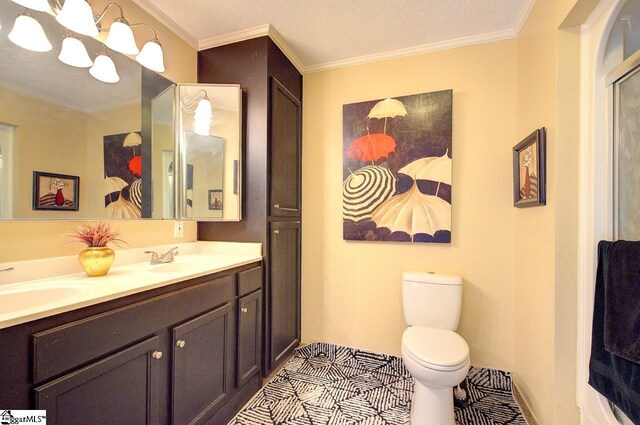 full bathroom with crown molding, double vanity, toilet, and a sink