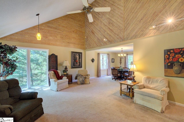 carpeted living area with high vaulted ceiling, wooden ceiling, baseboards, and ceiling fan with notable chandelier