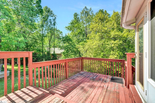 wooden terrace with a yard