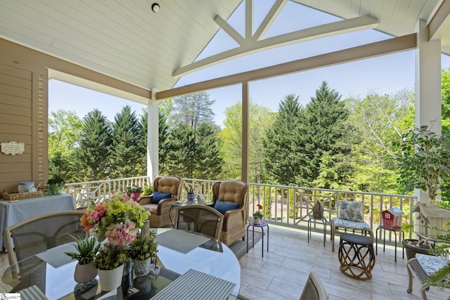 sunroom with outdoor lounge area and a healthy amount of sunlight