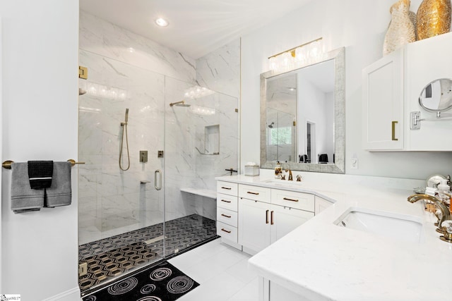 full bathroom featuring recessed lighting, tile patterned floors, double vanity, a marble finish shower, and a sink
