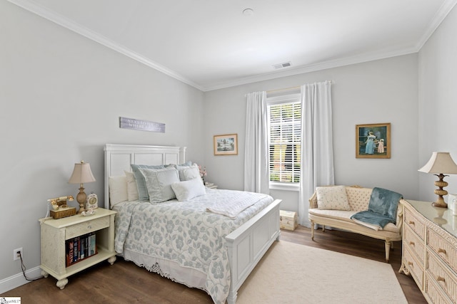 bedroom featuring visible vents, ornamental molding, baseboards, and dark wood-style flooring
