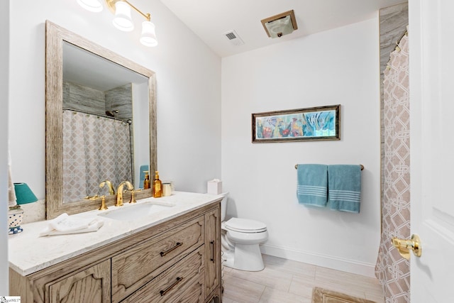 bathroom featuring toilet, baseboards, visible vents, curtained shower, and vanity