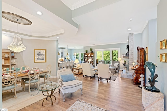 living room featuring ornamental molding, wood finished floors, and recessed lighting
