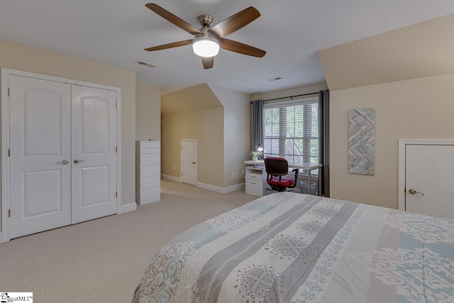 bedroom with visible vents, light carpet, a closet, baseboards, and ceiling fan