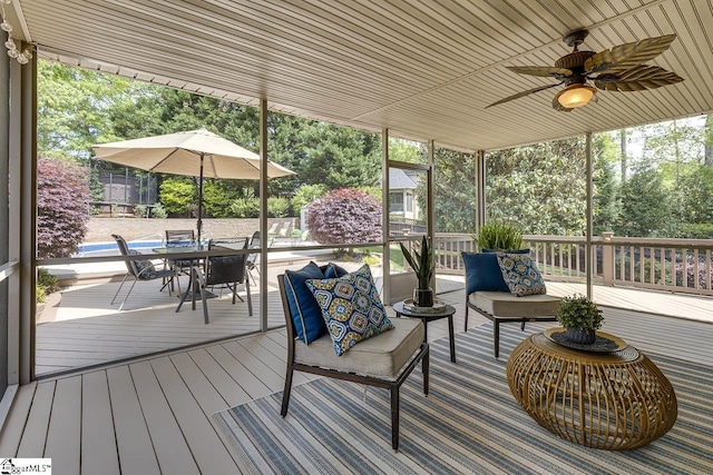 wooden terrace featuring an outdoor hangout area, outdoor dining space, and ceiling fan