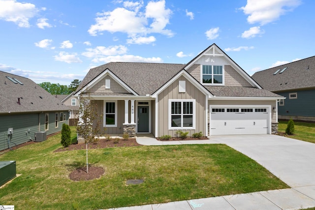 craftsman inspired home featuring central AC, a front lawn, driveway, board and batten siding, and covered porch