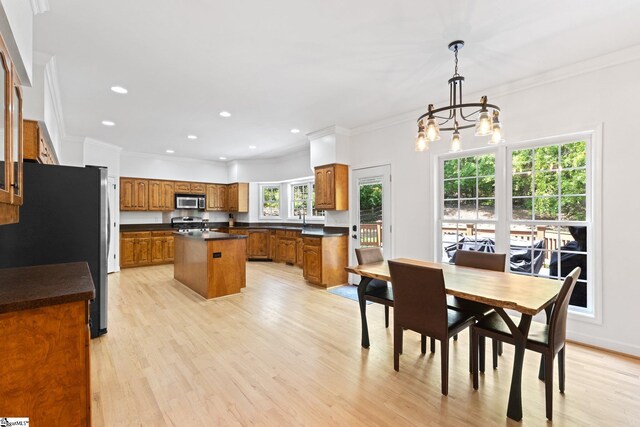 361 E Killarney Lk, Moore, SC 29369 - dining area with a chandelier, light wood-style flooring, and crown molding