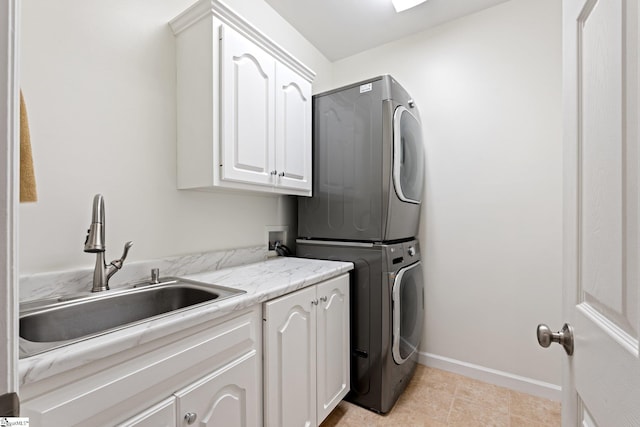 361 E Killarney Lk, Moore, SC 29369 - laundry area featuring cabinet space, stacked washer and dryer, baseboards, and a sink