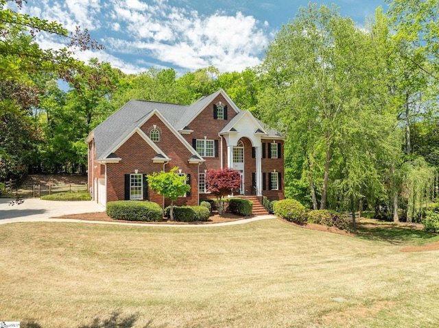 361 E Killarney Lk, Moore, SC 29369 - view of front facade with brick siding, a front lawn, driveway, and a garage