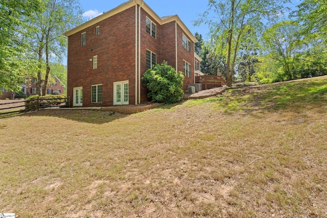361 E Killarney Lk, Moore, SC 29369 - view of property exterior featuring fence, cooling unit, french doors, a lawn, and brick siding