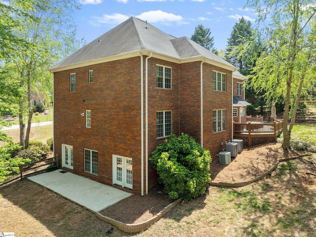 361 E Killarney Lk, Moore, SC 29369 - view of side of home featuring a shingled roof, central air condition unit, a patio, brick siding, and a deck