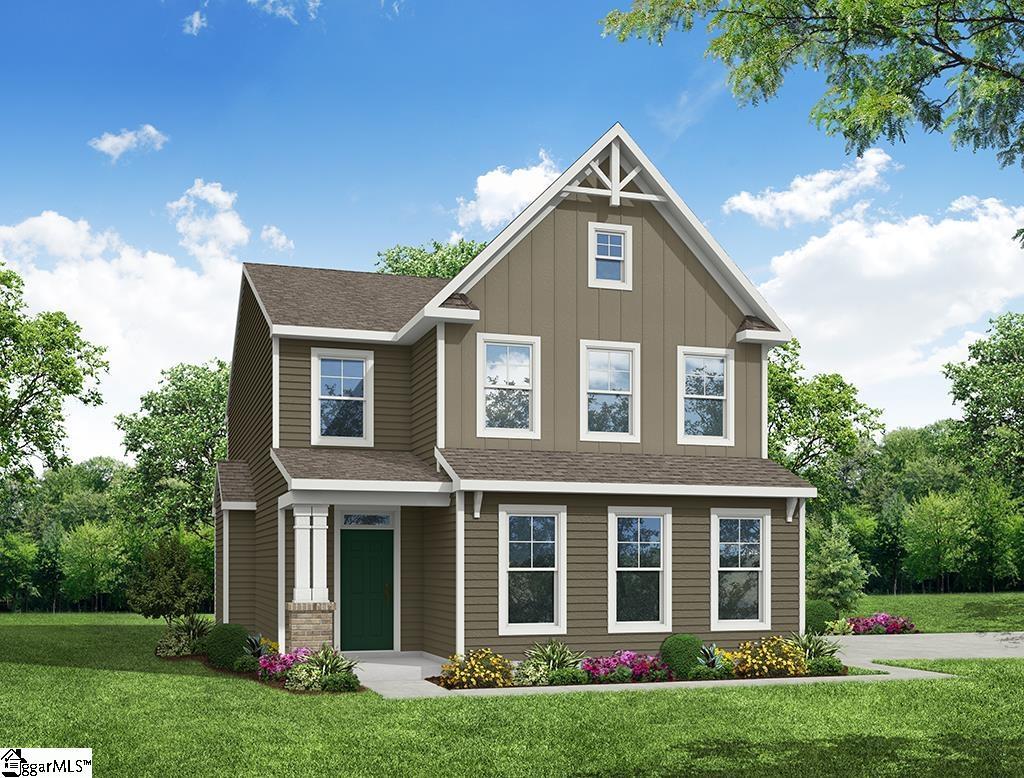 craftsman-style house featuring board and batten siding, a shingled roof, and a front yard