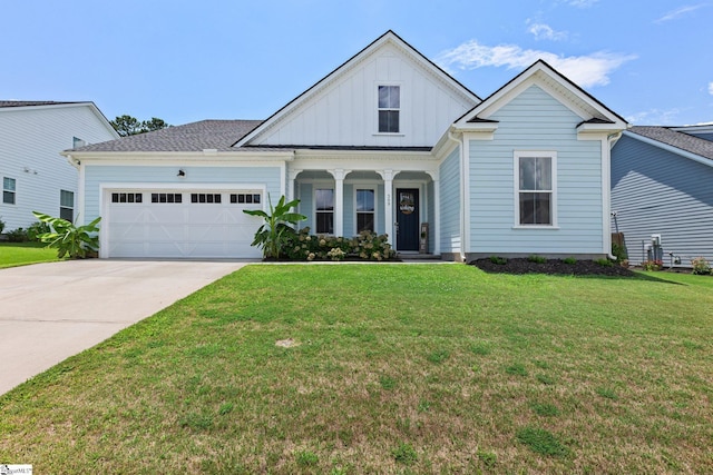309 Nebbiolo Ln, Simpsonville, SC 29681 - view of front facade featuring board and batten siding, an attached garage, a front yard, concrete driveway, and a porch