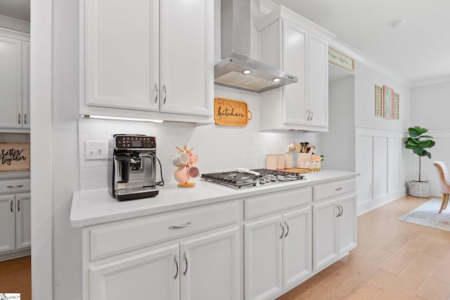 309 Nebbiolo Ln, Simpsonville, SC 29681 - kitchen featuring wall chimney exhaust hood, stainless steel gas stovetop, decorative backsplash, white cabinetry, and light countertops