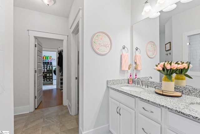 309 Nebbiolo Ln, Simpsonville, SC 29681 - bathroom featuring baseboards, double vanity, and washer / clothes dryer