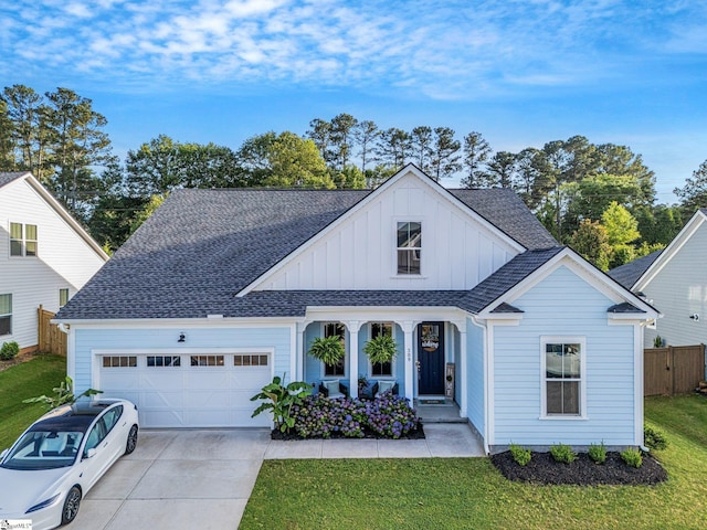 309 Nebbiolo Ln, Simpsonville, SC 29681 - view of front of property with board and batten siding, an attached garage, concrete driveway, and roof with shingles