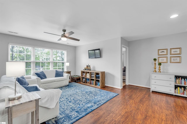 living area with a ceiling fan, wood finished floors, baseboards, visible vents, and recessed lighting
