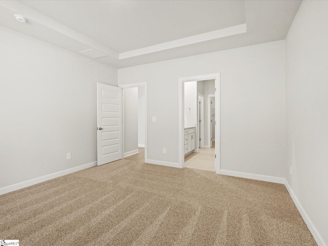 225 Maxwell Dr, Easley, SC 29642 - unfurnished bedroom with light carpet, baseboards, and a raised ceiling