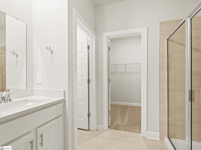 225 Maxwell Dr, Easley, SC 29642 - full bath featuring a shower stall, vanity, a walk in closet, and tile patterned flooring
