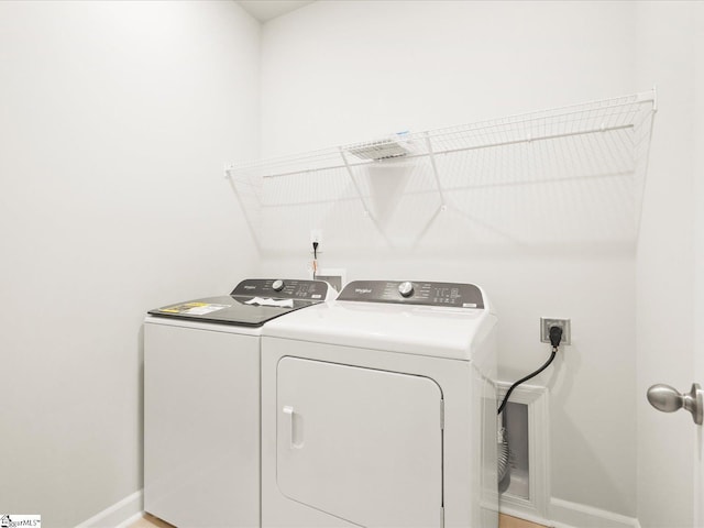 225 Maxwell Dr, Easley, SC 29642 - washroom with baseboards and washer and dryer