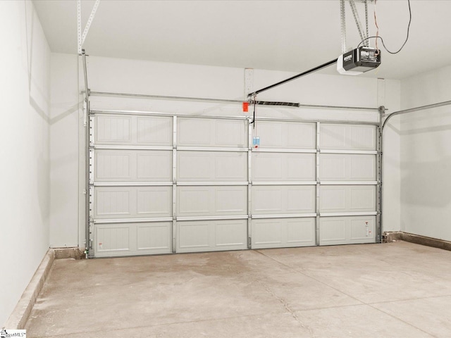225 Maxwell Dr, Easley, SC 29642 - garage featuring a garage door opener and baseboards