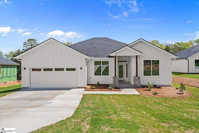 204 Tot Howell Rd, Greer, SC 29651 - view of front facade with an attached garage, a front lawn, board and batten siding, and concrete driveway