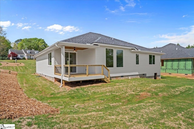 204 Tot Howell Rd, Greer, SC 29651 - rear view of property with crawl space, a deck, a ceiling fan, a shingled roof, and a yard
