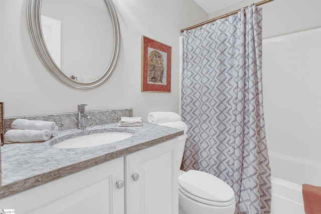 bathroom featuring shower / bath combo, toilet, and vanity