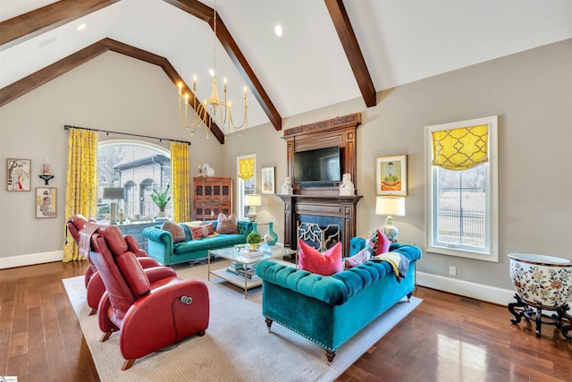 living area with beam ceiling, baseboards, a chandelier, hardwood / wood-style floors, and high vaulted ceiling