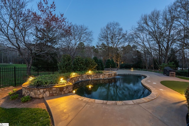 view of swimming pool featuring fence, a patio area, and a fenced in pool