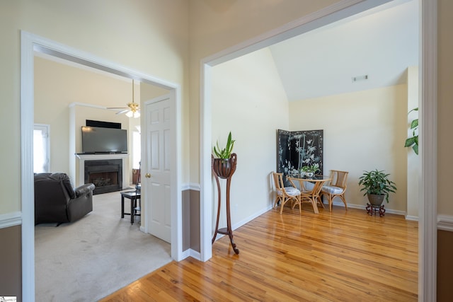 103 Graclan Ct, Simpsonville, SC 29680 - interior space featuring a ceiling fan, light wood-style flooring, a fireplace, lofted ceiling, and visible vents