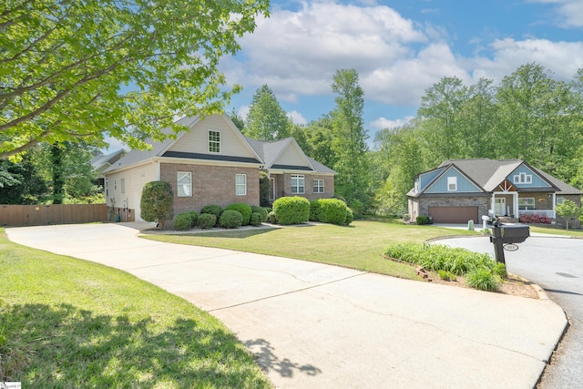 103 Graclan Ct, Simpsonville, SC 29680 - view of front of property with brick siding, driveway, a front yard, and fence