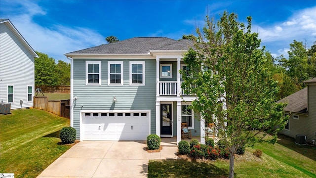 200 Noble St, Greer, SC 29651 - view of front of property with central AC, concrete driveway, an attached garage, fence, and a front yard