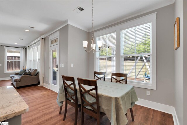 200 Noble St, Greer, SC 29651 - dining room featuring an inviting chandelier, a healthy amount of sunlight, visible vents, and light wood-type flooring
