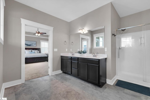200 Noble St, Greer, SC 29651 - ensuite bathroom featuring double vanity, a shower stall, baseboards, and a sink