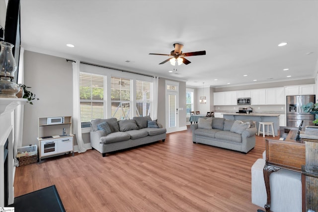 200 Noble St, Greer, SC 29651 - living area featuring recessed lighting, light wood-style floors, a ceiling fan, and ornamental molding