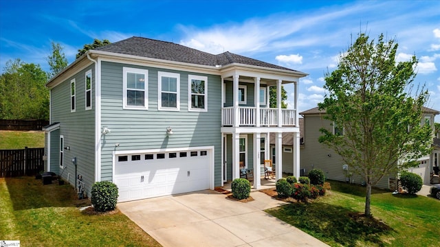 200 Noble St, Greer, SC 29651 - view of front facade featuring an attached garage, driveway, a front lawn, and a balcony