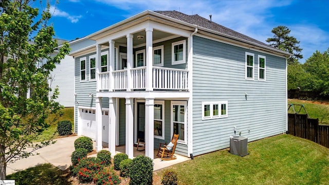200 Noble St, Greer, SC 29651 - rear view of house with cooling unit, concrete driveway, fence, a lawn, and a balcony