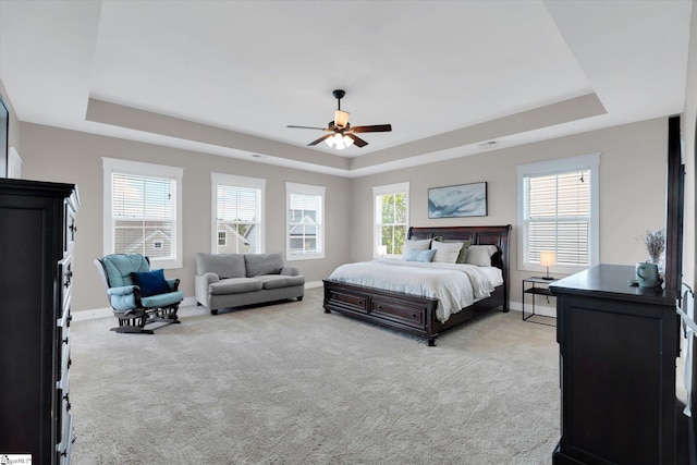 200 Noble St, Greer, SC 29651 - bedroom with visible vents, baseboards, light colored carpet, a ceiling fan, and a raised ceiling