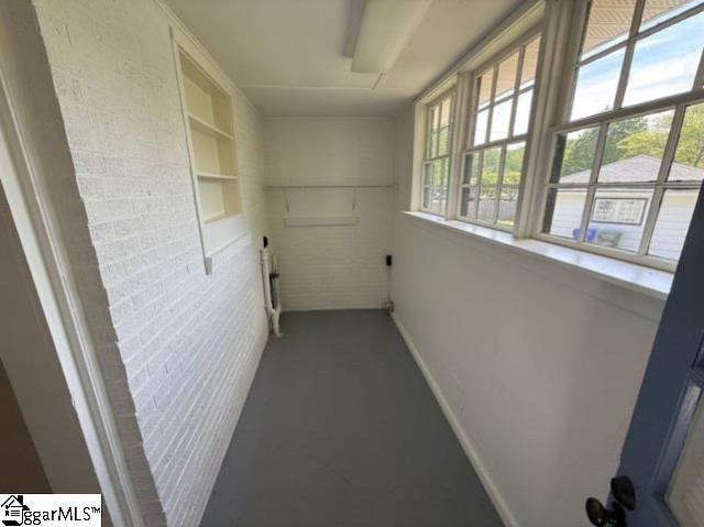 28 Alpine Way, Greenville, SC 29609 - hallway featuring radiator heating unit, baseboards, and built in shelves