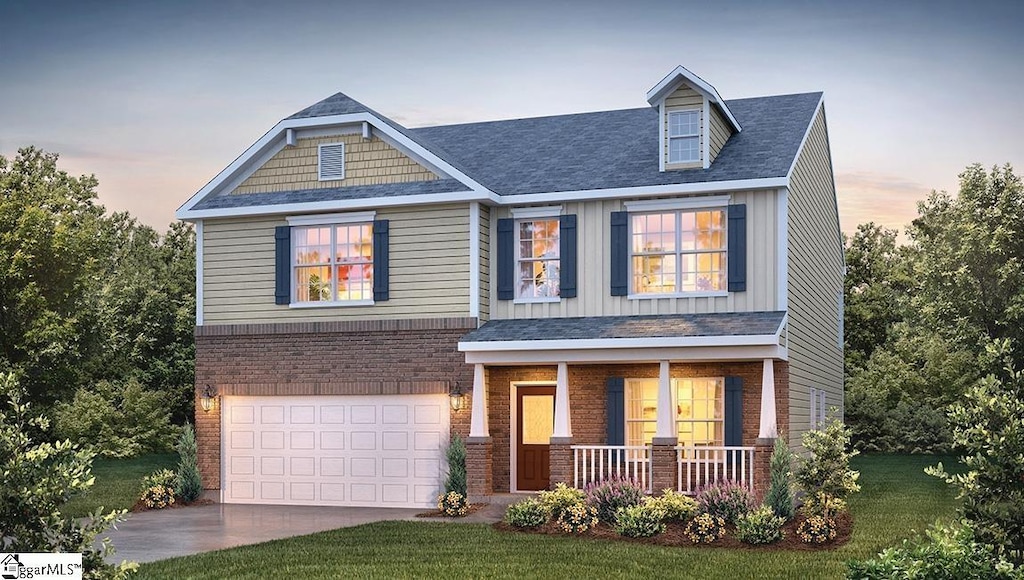 craftsman-style house featuring a porch, concrete driveway, brick siding, an attached garage, and a yard
