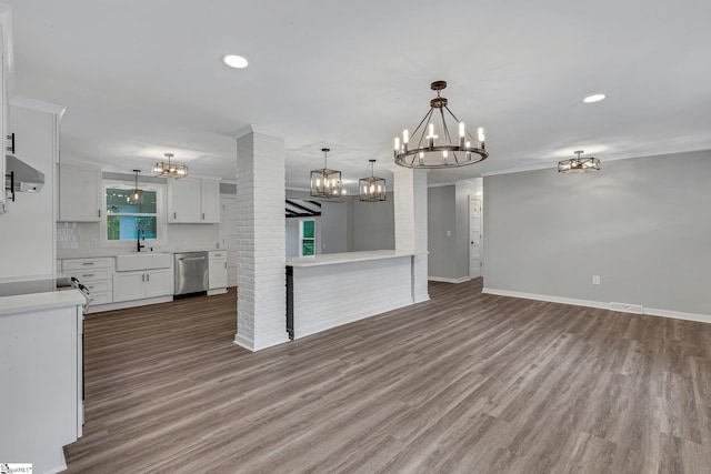 181 Skyland Dr, Clinton, SC 29325 - interior space featuring a notable chandelier, light countertops, dishwasher, a sink, and white cabinetry