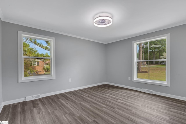 181 Skyland Dr, Clinton, SC 29325 - empty room with dark wood finished floors, a healthy amount of sunlight, and crown molding