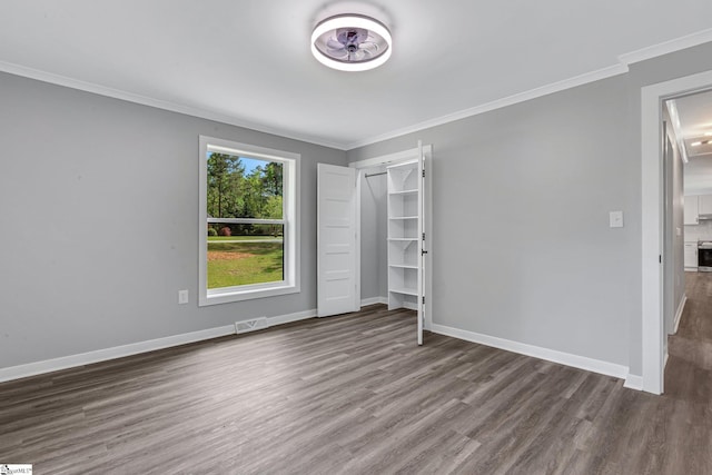 181 Skyland Dr, Clinton, SC 29325 - unfurnished bedroom featuring wood finished floors, visible vents, baseboards, and ornamental molding