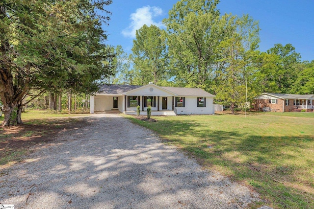 181 Skyland Dr, Clinton, SC 29325 - single story home with gravel driveway, an attached carport, a front lawn, and covered porch