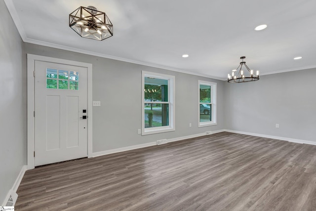 181 Skyland Dr, Clinton, SC 29325 - entrance foyer with ornamental molding, dark wood-style flooring, a notable chandelier, and recessed lighting