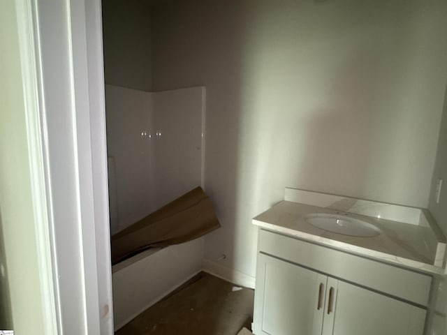 bathroom featuring baseboards and vanity