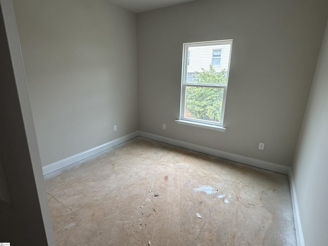 empty room with baseboards