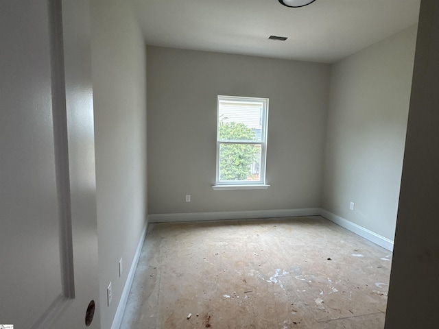 empty room featuring visible vents and baseboards